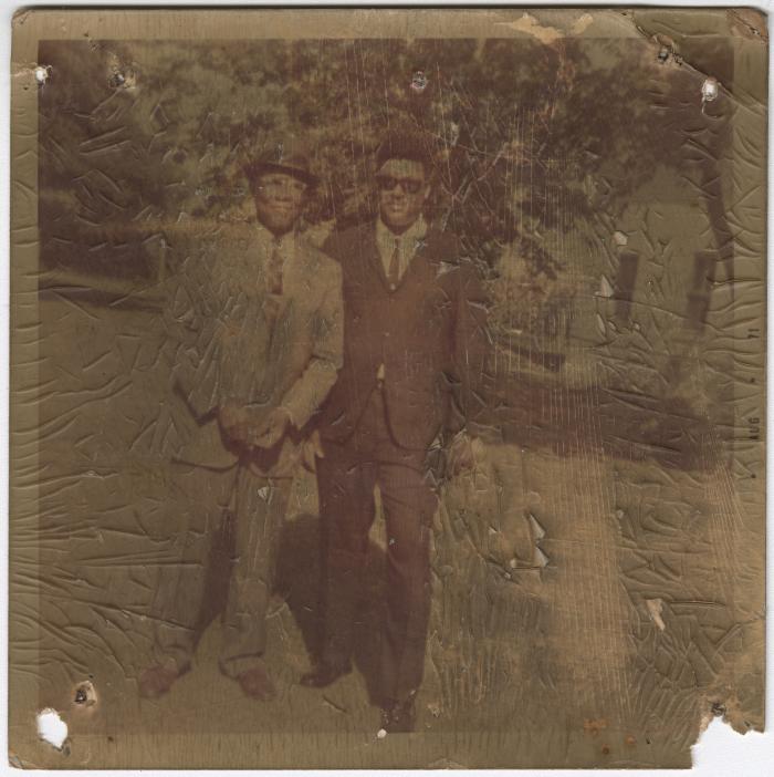 Worn Photo of Two Men in Suits