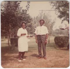 Formally Dressed Man and Woman Standing Outside