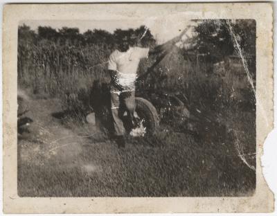 Old Photograph of a Man with a Piece of Farm Equipment 