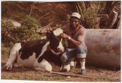 Marvin Jones Posing with a Small Cow 