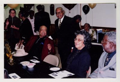 Sam Ringgold Sr. standing among guests