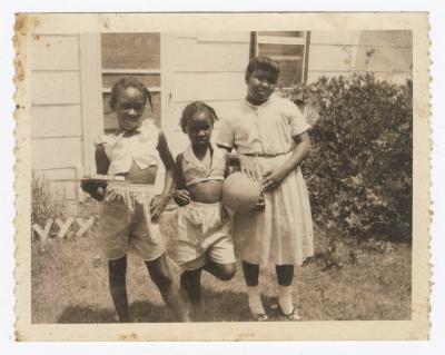 Claudine Dotson, Vanessa Dotson, and Valerie Bessick posing outside 