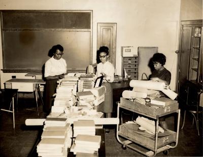 Mrs. Marie Brown, Home Economics Teacher, and students in a Kennard High School classroom