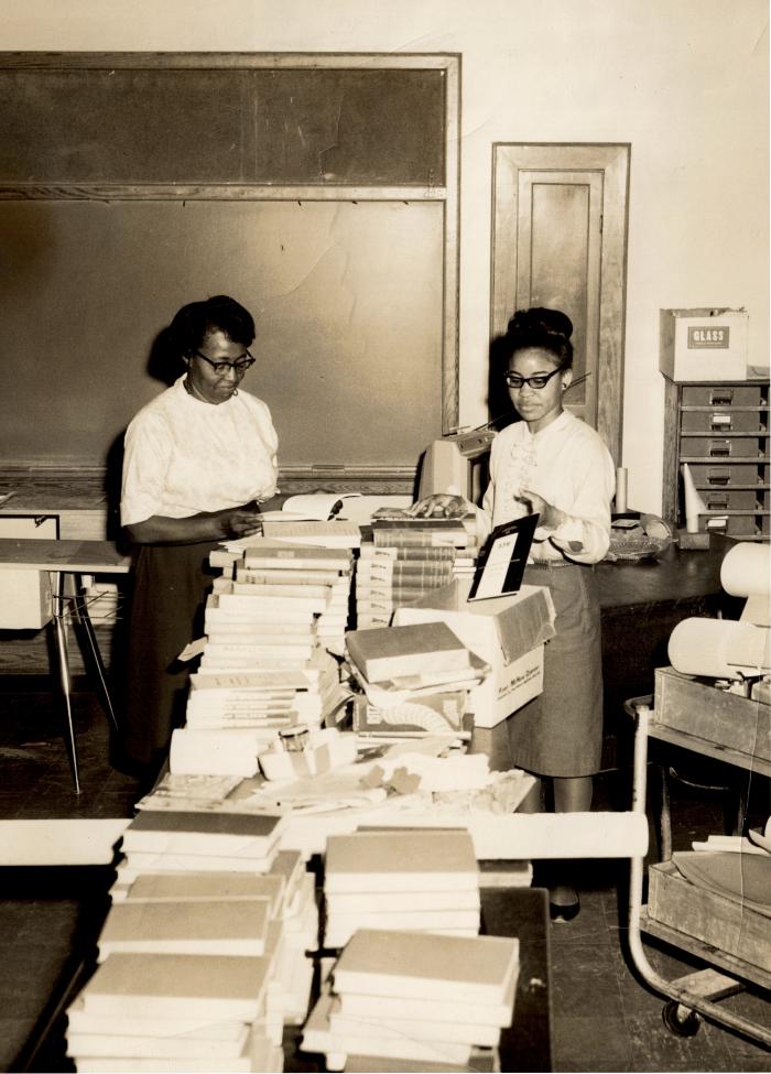 Detail of Mrs. Marie Brown, Home Economics Teacher, and students in a Kennard High School classroom