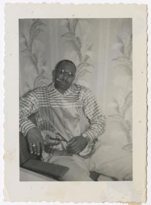 Black and White Photo of a Man Smoking a Cigar