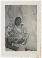Black and White Photo of a Man Smoking a Cigar