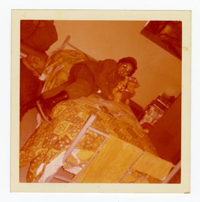 Eleanor Rochelle Ringgold laying on a bed