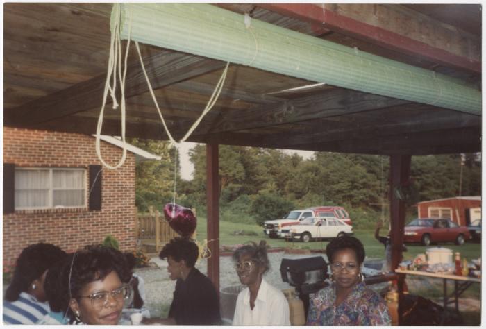 A Group of Women Gathered Under a Pavilion for a Party