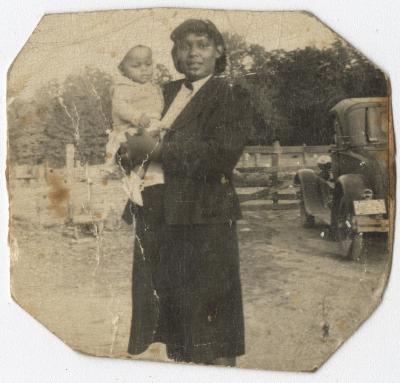 Black and White Photo of a Woman with a Baby