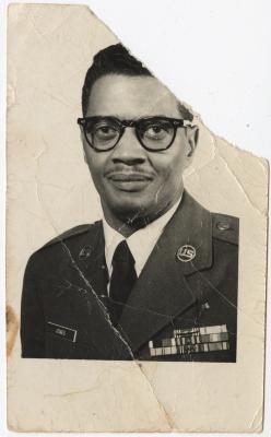 Black and White Photo of a Man in a Military Uniform