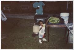 A Toddler Outside During a Gathering