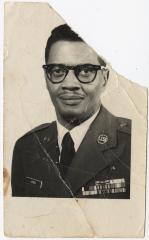 Black and White Photo of a Man in a Military Uniform