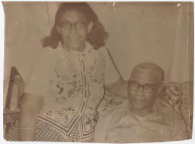 A Couple Sitting Together on a Couch