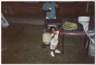 A Toddler Outside During a Gathering