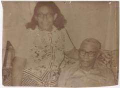 A Couple Sitting Together on a Couch