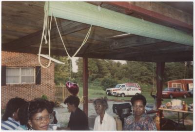 A Group of Women Gathered Under a Pavilion for a Party