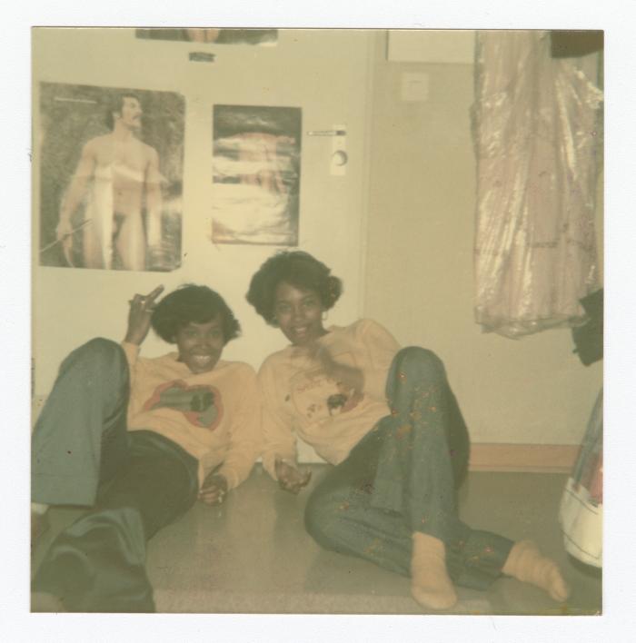 Eleanor Rochelle Ringgold and friend posing on the floor