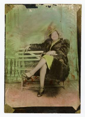 Rose Etta Hutchins seated on a bench 