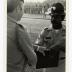 Two men in uniform shaking hands 