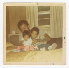 Dolson Anderson Jr. playing with his children