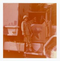 Eleanor Rochelle Ringgold standing on military vehicle 