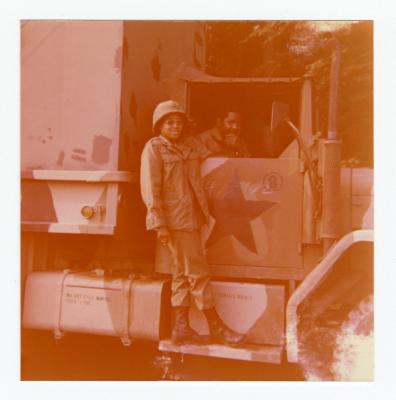 Eleanor Rochelle Ringgold standing on military vehicle 