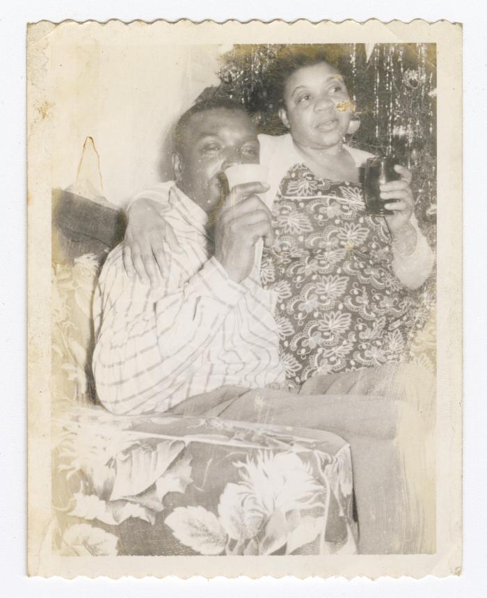 Oliver Hopkins and Helen Hamilton sipping drinks