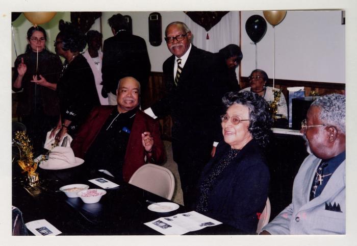 Sam Ringgold Sr. standing among guests