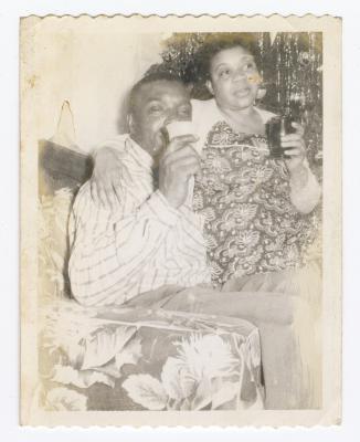 Oliver Hopkins and Helen Hamilton sipping drinks