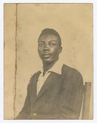 Clarence Hamilton seated