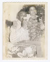 Oliver Hopkins and Helen Hamilton sipping drinks