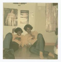 Eleanor Rochelle Ringgold and friend posing on the floor