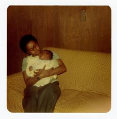 Eleanor Rochelle Ringgold snuggling a baby
