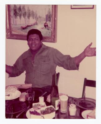 Corey "Fat Cat" Hackett seated at a table