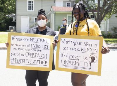 Two women with protest signs