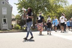 Woman leading march with bullhorn