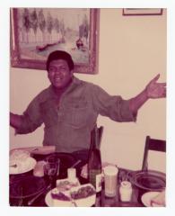 Corey "Fat Cat" Hackett seated at a table