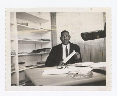 Oliver E. Briscoe at a desk
