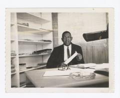 Oliver E. Briscoe at a desk