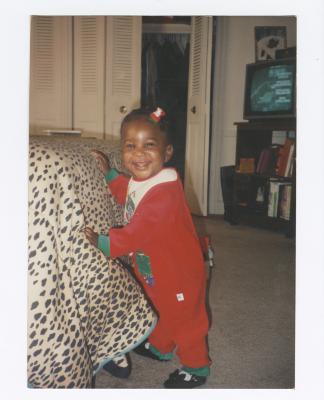 Imani Briscoe in red onesie