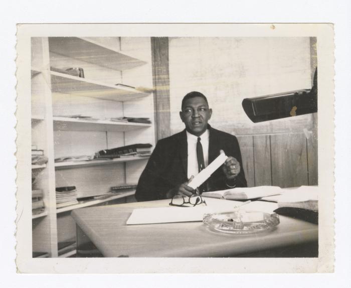 Oliver E. Briscoe at a desk